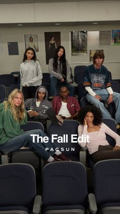Group of young adults in casual clothing sitting in an auditorium