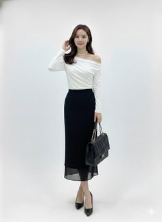 Woman in a white off-shoulder top and black skirt with a quilted handbag