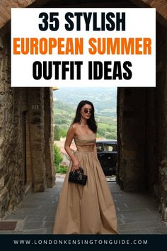 Woman in a crop top and long skirt standing in a stone archway