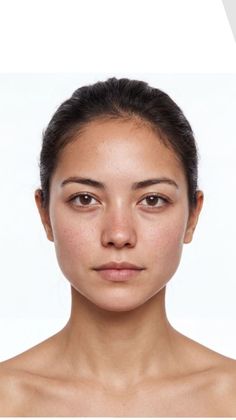 Woman with dark hair and brown eyes against a white background