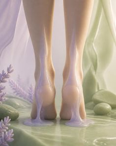 Bare feet with purple liquid dripping, surrounded by lavender and green fabric