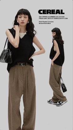 Two women in black vests and plaid trousers posing in a studio