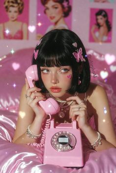 Woman with short black hair and pink butterfly clips holding a pink rotary phone