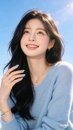 Smiling woman with long black hair and a blue sweater looking up at the sky