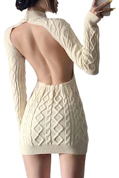 Woman in a backless knit dress with long sleeves and hoop earrings