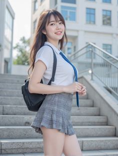 Young woman in a school uniform with a plaid skirt and blue tie on outdoor stairs