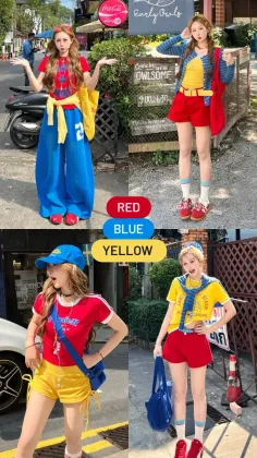 Four women posing in red, blue, and yellow outfits on a street