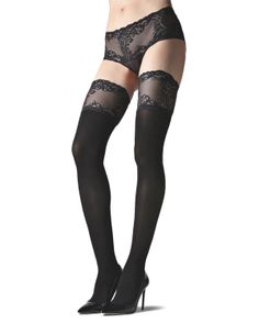 Woman wearing black lace-trim stockings and black lace panties with high heels