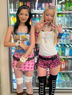 Two women in colorful, alternative fashion posing in a convenience store