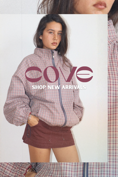 Woman in a plaid jacket and mini skirt with hands in pockets