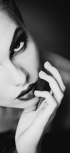 Close up black and white portrait with dark lipstick and dramatic lighting