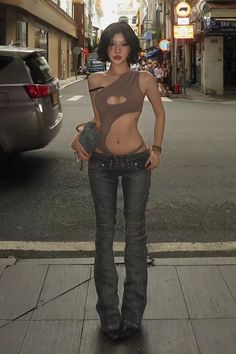 Woman in a cutout top and low rise jeans on a street