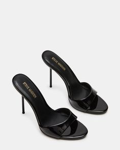 Pair of black patent leather high heels with stiletto heels