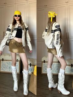 Woman in a racing jacket, mini skirt, and cowboy boots posing indoors