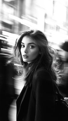Woman with long hair in a black and white portrait with motion blur