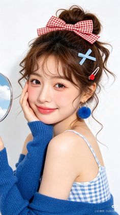 Woman with a red bow in her hair and a blue sweater, holding a mirror