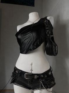 Mannequin dressed in a black leather top, denim shorts, and gothic accessories