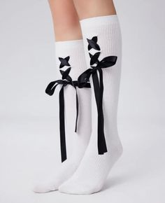 White knee socks with black ribbon bows and lace-up detail