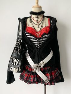 Gothic style outfit on a mannequin with a red bra and plaid skirt