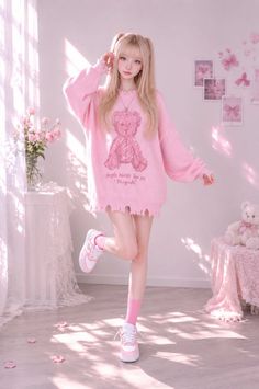 Woman in a pink teddy bear sweater and pigtails in a pink-themed room