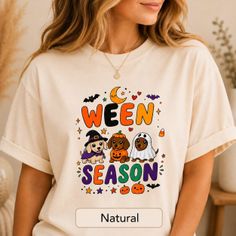 Woman wearing a t-shirt with a Halloween-themed puppy illustration