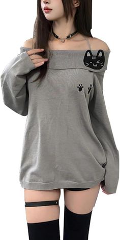 Woman in an off-shoulder cat-themed top with thigh-high socks and a garter