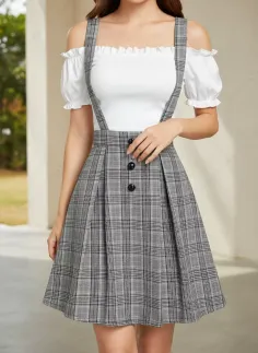 Woman in a white off-shoulder top and a gray plaid pleated skirt