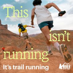People trail running on a dirt path in a desert landscape