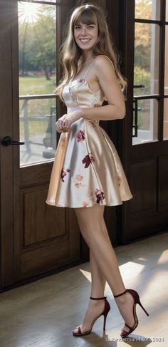 Woman in a floral satin dress and high heels standing indoors
