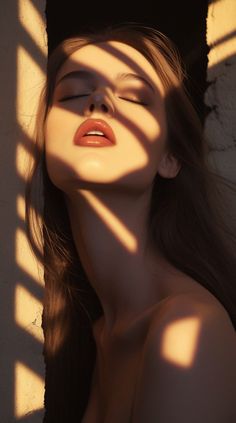 Woman with closed eyes and red lips in dramatic golden hour lighting
