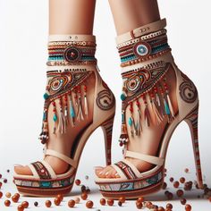 Pair of high heels with intricate beadwork and tassels on a white background