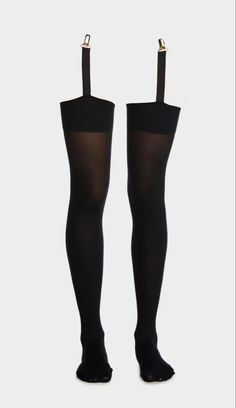 Pair of black thigh-high stockings with garter straps on a white background