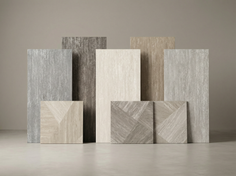 Collection of textured floor and wall tiles in various neutral tones and patterns