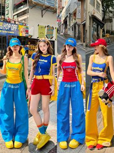 Four women in colorful street fashion posing on an urban street
