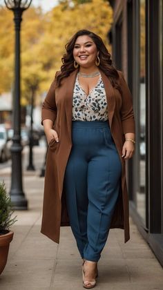 Woman in a brown coat and blue pants walking on a street