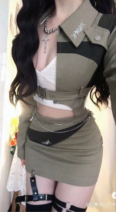 Woman in a cropped jacket and mini skirt with a cross necklace and garter belt