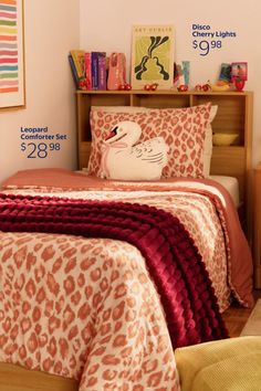 Bedroom with leopard print bedding, a swan pillow, and a wooden headboard with decor