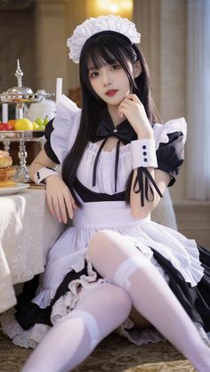 Woman in a maid outfit and white thigh highs sitting indoors