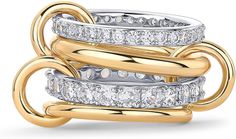Stack of gold and silver rings with diamonds on a white background