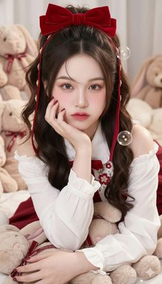 Woman with a red bow in her hair and an off-shoulder top surrounded by plush toys