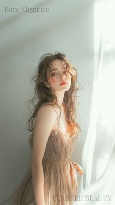 Woman with long wavy hair in a ruffled dress with soft backlight