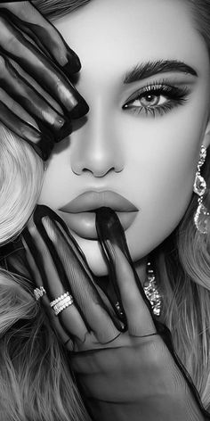 Woman with sheer gloves covering her face and finger on her lips