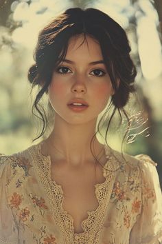Woman with dark hair and freckles wearing a floral dress with lace trim outdoors