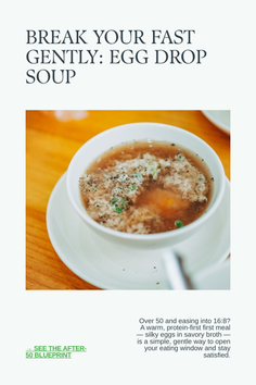 Egg drop soup in a white bowl on a wooden table