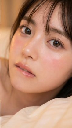 Close up portrait of a woman with soft lighting and pink blush