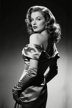 Woman in an off-shoulder dress and long gloves looking over her shoulder