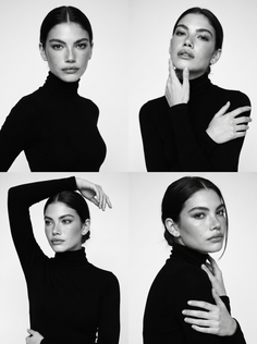 Woman in a black turtleneck posing in a black and white studio portrait