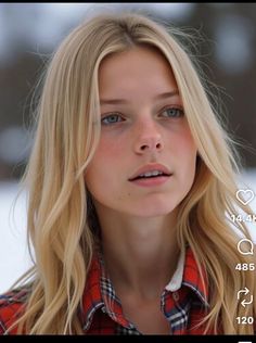 Young woman with blonde hair and blue eyes wearing a plaid shirt