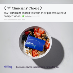 Yogurt bowl with berries, granola, and a Milky sachet on a white background