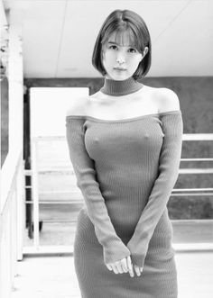 Woman in a tight off-shoulder ribbed dress with short hair, black and white photo
